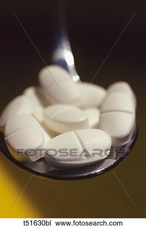 Pills on a spoon View Large Photo Image Stock Image - Pills on a spoon. Fotosearch