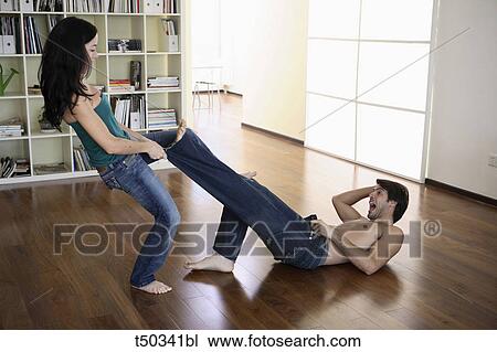 Playful couple at home View Large Photo Image Stock Image - Playful couple at home. Fotosearch