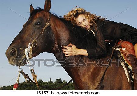 Portrait of a woman riding horse View Large Photo Image Stock Image - Portrait of a woman riding horse. Fotosearch