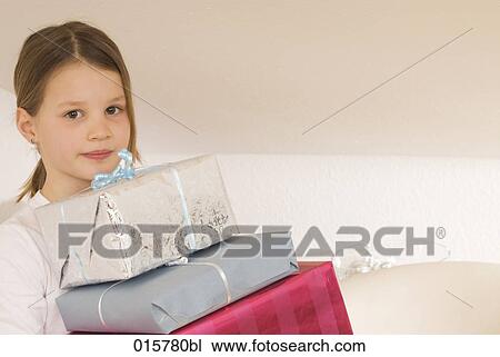 portrait of girl carrying christmas presents View Large Photo Image Stock Image - portrait of girl carrying christmas presents. Fotosearch