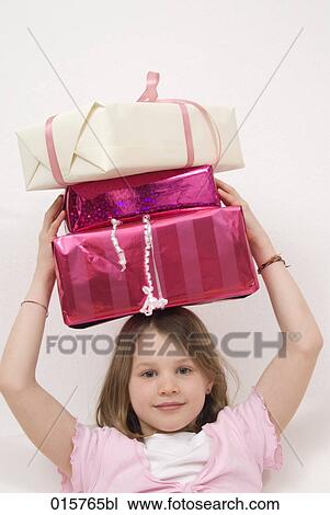 portrait of girl carrying presents on her head View Large Photo Image Stock Image - portrait of girl carrying presents on her head. Fotosearch