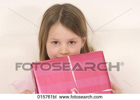 portrait of girl hiding behind present View Large Photo Image Stock Image - portrait of girl hiding behind present. Fotosearch