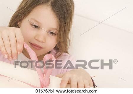 portrait of girl opening present View Large Photo Image Stock Image - portrait of girl opening present. Fotosearch