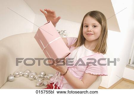 portrait of girl with christmas present View Large Photo Image Stock Image - portrait of girl with christmas present. Fotosearch