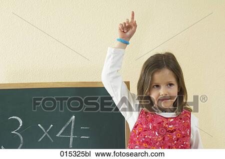 portrait of little girl raising finger to answer question at school View Large Photo Image Stock Image - portrait of little girl raising finger to answer question at school. Fotosearch