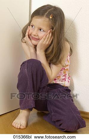 portrait of little girl sitting in a corner View Large Photo Image Stock Image - portrait of little girl sitting in a corner. Fotosearch