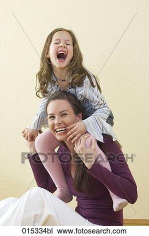 portrait of mother and daughter having fun together at home View Large Photo Image Stock Image - portrait of mother and daughter having fun together at home. Fotosearch