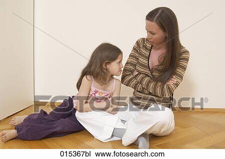portrait of mother and sulking daughter sitting on floor View Large Photo Image Stock Image - portrait of mother and sulking daughter sitting on floor. Fotosearch