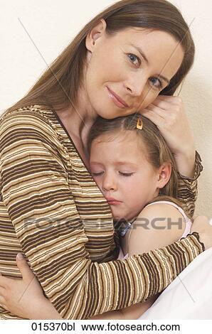 portrait of mother comforting her little daughter View Large Photo Image Stock Image - portrait of mother comforting her little daughter. Fotosearch