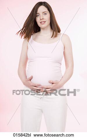 portrait of pregnant young woman looking at camera View Large Photo Image Stock Image - portrait of pregnant young woman looking at camera. Fotosearch