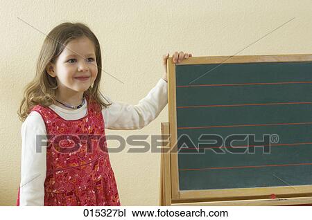 portrait of smiling young girl standing at empty blackboard View Large Photo Image Stock Image - portrait of smiling young girl standing at empty blackboard. Fotosearch