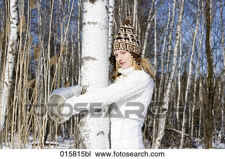 portrait of teenage girl in winter embracing tree View Large Photo Image Stock Image - portrait of teenage girl in winter embracing tree. Fotosearch