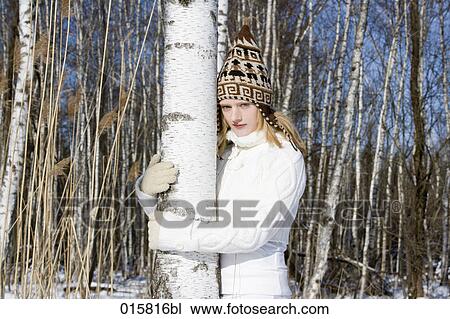 portrait of teenage girl in winter embracing tree View Large Photo Image Stock Image - portrait of teenage girl in winter embracing tree. Fotosearch