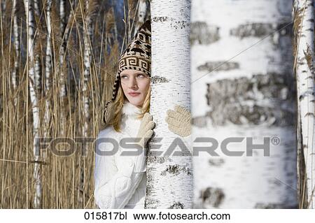 Stock Image - portrait of teenage girl in winter forest. Fotosearch