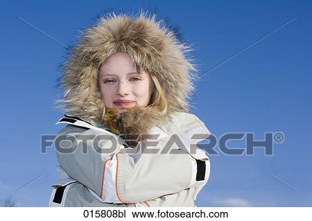 portrait of teenage girl protecting herself from winter coldness View Large Photo Image Stock Image - portrait of teenage girl protecting herself from winter coldness. Fotosearch