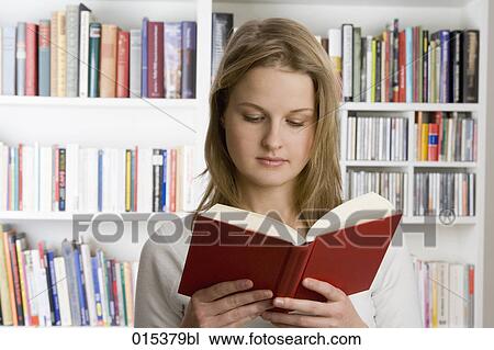 portrait of teenage girl reading book in library View Large Photo Image Stock Image - portrait of teenage girl reading book in library. Fotosearch