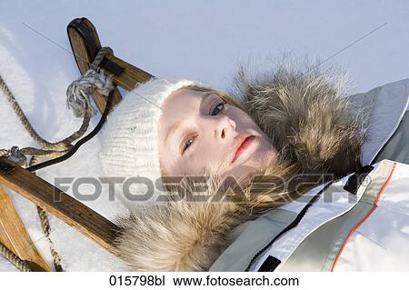 portrait of teenage girl relaxing on sledge View Large Photo Image Stock Image - portrait of teenage girl relaxing on sledge. Fotosearch