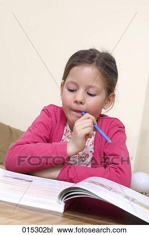 portrait of young girl doing her homework View Large Photo Image Stock Image - portrait of young girl doing her homework. Fotosearch