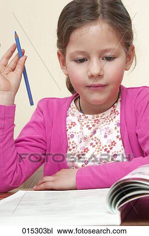 portrait of young girl doing her homework View Large Photo Image Stock Image - portrait of young girl doing her homework. Fotosearch