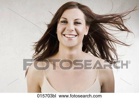 portrait of young woman with windswept hair View Large Photo Image Stock Image - portrait of young woman with windswept hair. Fotosearch