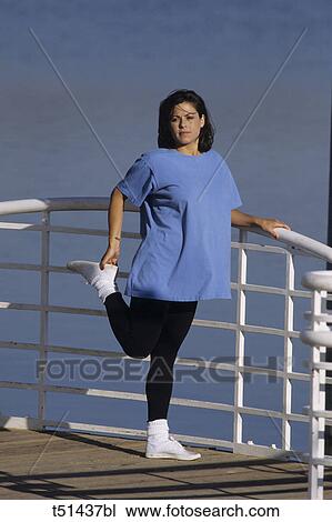 Pregnant woman exercising outdoors View Large Photo Image Stock Image - Pregnant woman exercising outdoors. Fotosearch