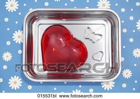 red heart and cookie cutter in shape of butterfly in silver bowl View Large Photo Image Stock Image - red heart and cookie cutter in shape of butterfly in silver bowl. Fotosearch