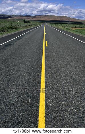 Road with yellow strip heading off to the distant mountains in the Western United States View Large Photo Image Stock Image - Road with yellow strip heading off to the distant mountains in the Western United States. Fotosearch