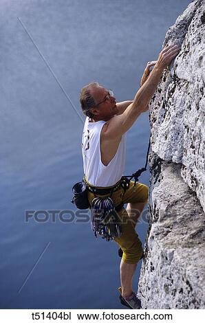 Rock climber, side view View Large Photo Image Stock Image - Rock climber, side view. Fotosearch