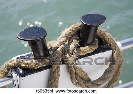 Ropes rolled up on a boat's deck View Large Photo Image Stock Image - Ropes rolled up on a boat's deck. Fotosearch