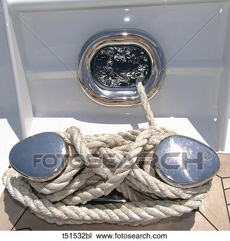 Ropes rolled up on a sailboat's deck View Large Photo Image Stock Image - Ropes rolled up on a sailboat's deck. Fotosearch