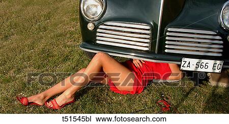 Sexy woman repairing car View Large Photo Image Stock Image - Sexy woman repairing car. Fotosearch