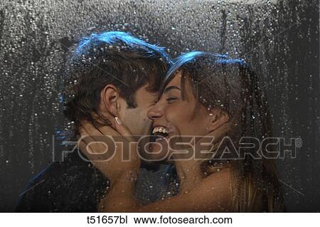 Smiling couple behind a wet window View Large Photo Image Stock Image - Smiling couple behind a wet window. Fotosearch