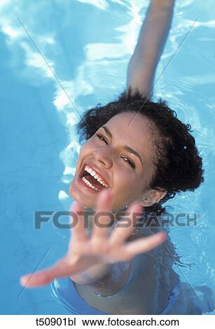 Smiling woman at swimming pool View Large Photo Image Stock Image - Smiling woman at swimming pool. Fotosearch