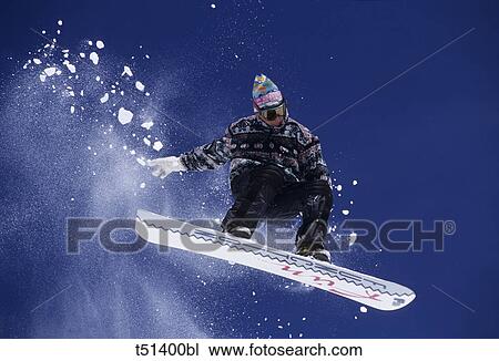 Snowboarder in the air View Large Photo Image Stock Image - Snowboarder in the air. Fotosearch