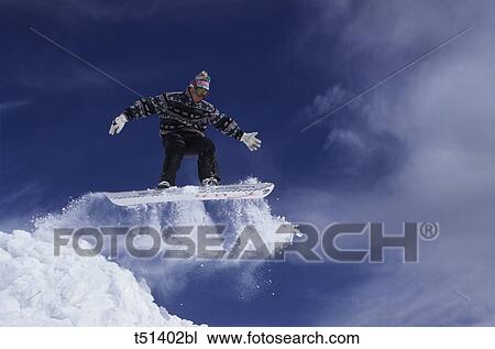 Snowboarder in the air View Large Photo Image Stock Image - Snowboarder in the air. Fotosearch