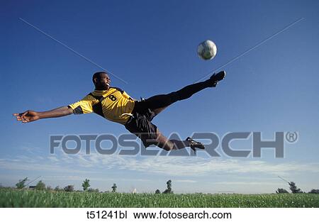 Soccer, soccer player kicking ball. View Large Photo Image Stock Image - Soccer, soccer player kicking ball.. Fotosearch