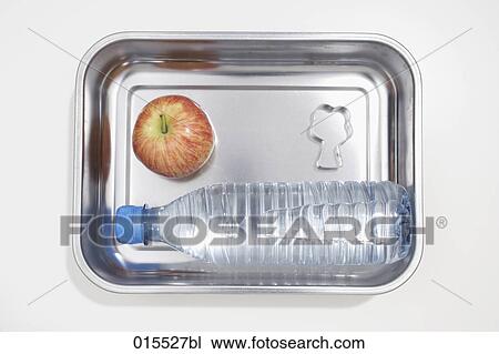 still life of apple cookie cutter in shape of tree and plastic bottle in silver bowl View Large Photo Image Stock Image - still life of apple cookie cutter in shape of tree and plastic bottle in silver bowl. Fotosearch