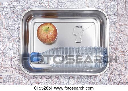 still life of apple cookie cutter in shape of tree and plastic bottle in silver bowl View Large Photo Image Stock Image - still life of apple cookie cutter in shape of tree and plastic bottle in silver bowl. Fotosearch
