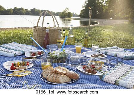 still life of barbecue picnic spread on blanket near lake View Large Photo Image Stock Image - still life of barbecue picnic spread on blanket near lake. Fotosearch