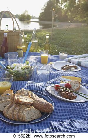 still life of barbecue picnic spread on blanket near lake View Large Photo Image Stock Image - still life of barbecue picnic spread on blanket near lake. Fotosearch