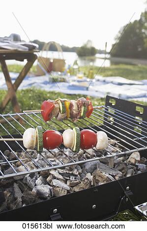 still life of barbecue with different shashlik on charcoal grill View Large Photo Image Stock Image - still life of barbecue with different shashlik on charcoal grill. Fotosearch