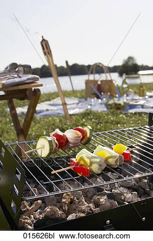 Stock Image - still life of barbecue with different shashlik on charcoal grill. Fotosearch