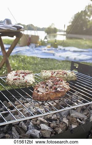 still life of barbecue with three steaks on charcoal grill View Large Photo Image Stock Image - still life of barbecue with three steaks on charcoal grill. Fotosearch