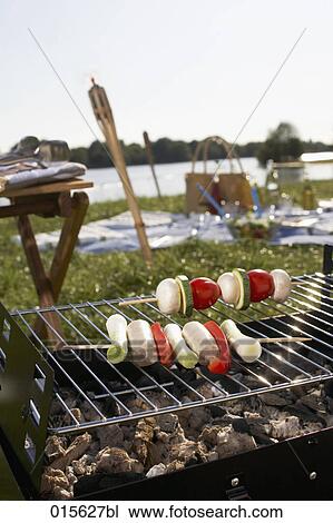 still life of barbecue with two shashlik on charcoal grill View Large Photo Image Stock Image - still life of barbecue with two shashlik on charcoal grill. Fotosearch