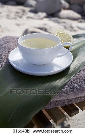 Stock Image - still life of cup with herbal tea. Fotosearch