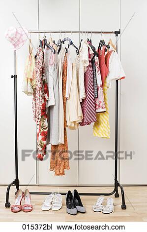 still life of female clothes hanging on wardrobe View Large Photo Image Stock Image - still life of female clothes hanging on wardrobe. Fotosearch