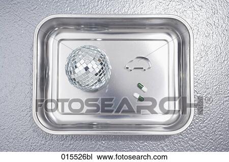 still life of glitter ball cookie cutter in shape of car and two pills in silver bowl View Large Photo Image Stock Image - still life of glitter ball cookie cutter in shape of car and two pills in silver bowl. Fotosearch
