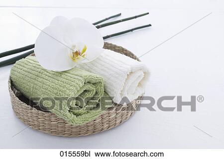 still life of orchid and towels in basket View Large Photo Image Stock Image - still life of orchid and towels in basket. Fotosearch