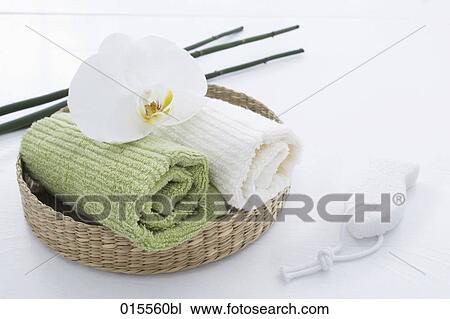 Stock Image - still life of orchid towels and sponge. Fotosearch