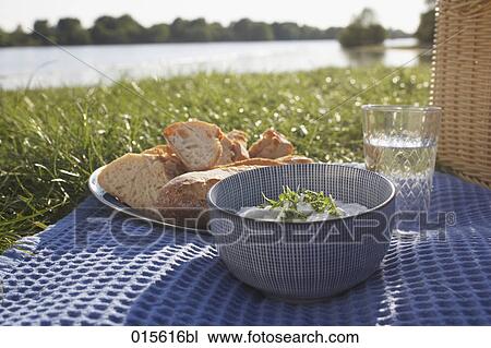 Stock Image - still life of picnic with bread and cream cheese. Fotosearch